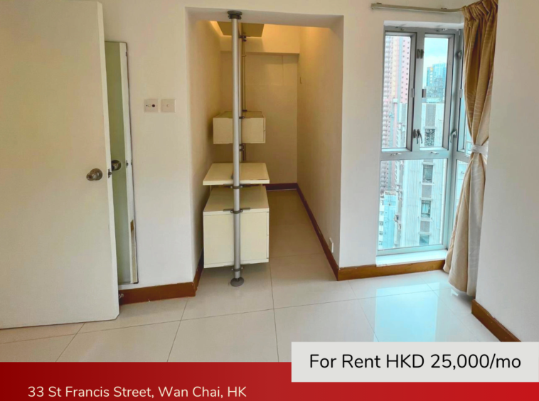 Walk-in closet with ample shelving and natural light