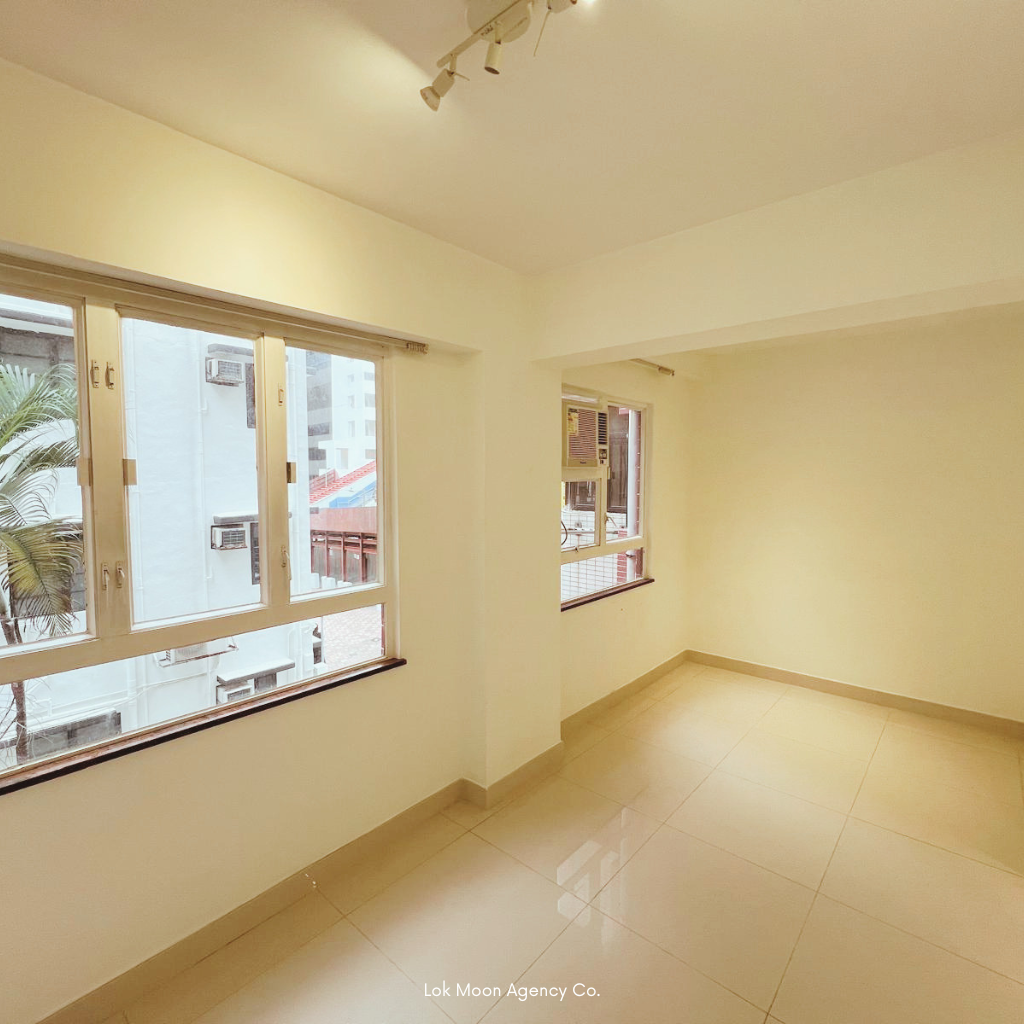 Wan Chai bedroom — one‑bed room with two air‑conditioners