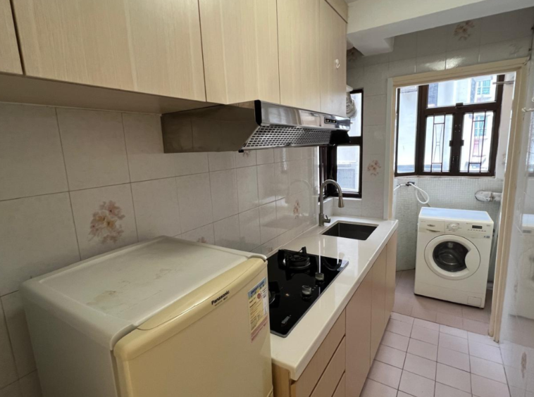 Wan Chai kitchenette — fitted gas hob and laundry hook‑up