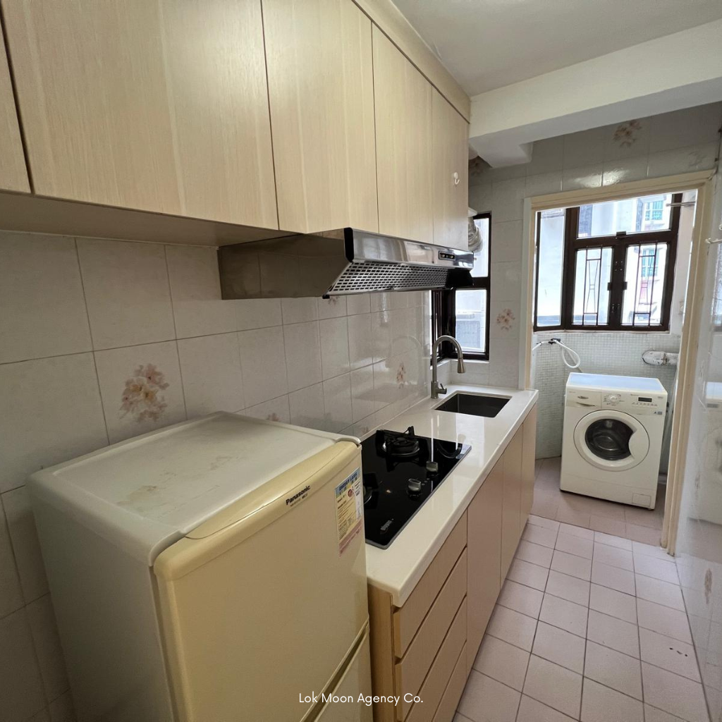 Wan Chai kitchenette — fitted gas hob and laundry hook‑up