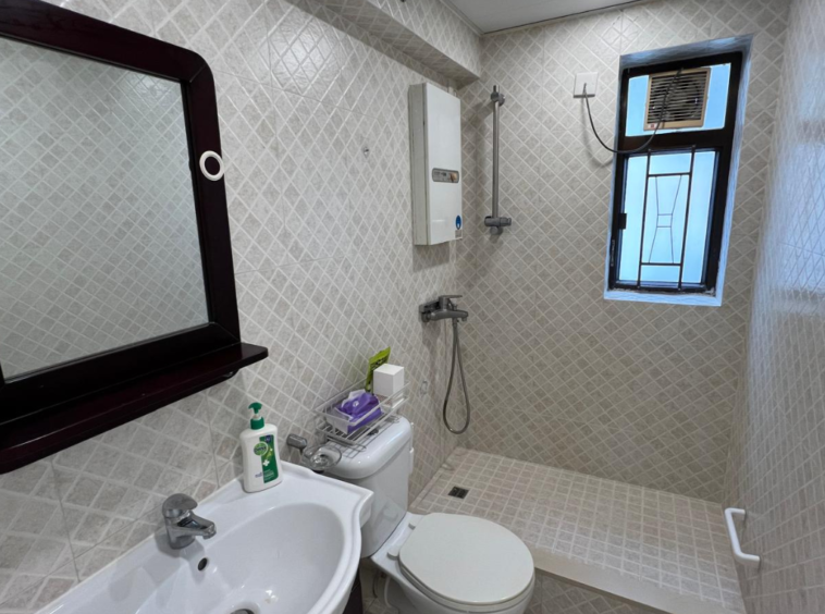 Wan Chai apartment bathroom — modern walk‑in shower with ventilation window
