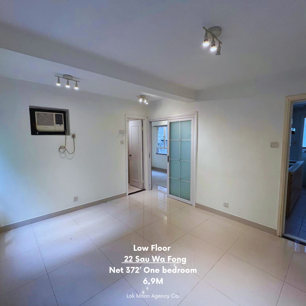 Wan Chai 1‑bed living room — bright windows